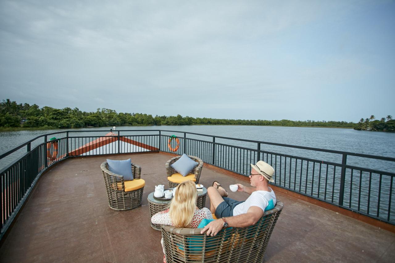 couple having a tea session on upper deck of flow 1  - Charters by Debug Auto Exclusive